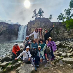 Take a break by a peaceful waterfall surrounded by the open landscapes of the Orkhon Valley.