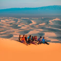 Climb the “singing” dunes for panoramic desert views at sunset